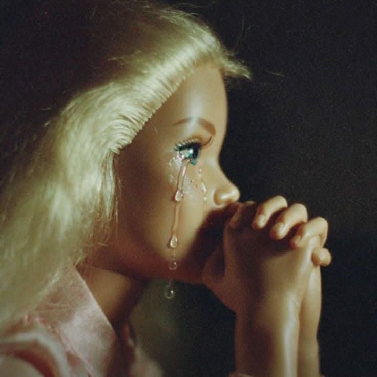 Crying praying Barbie magnet