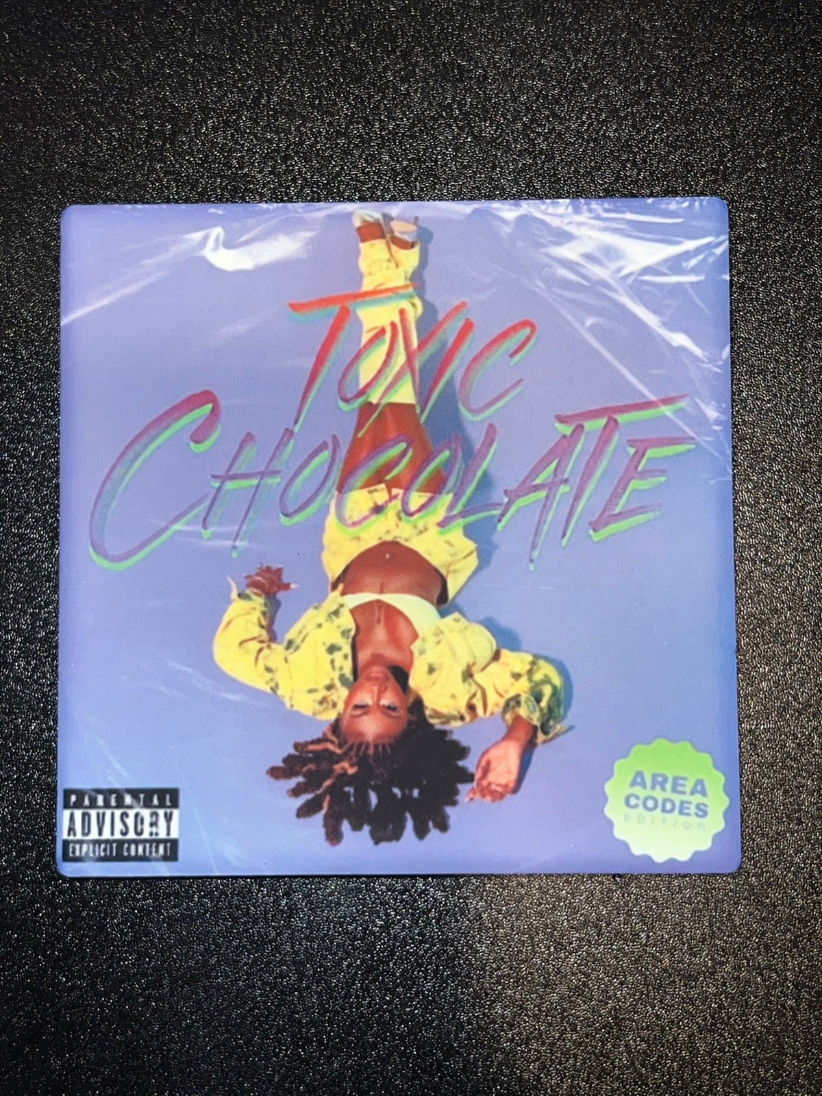 Kaliii Toxic Chocolate Area Codes Edition vinyl cover ceramic coaster